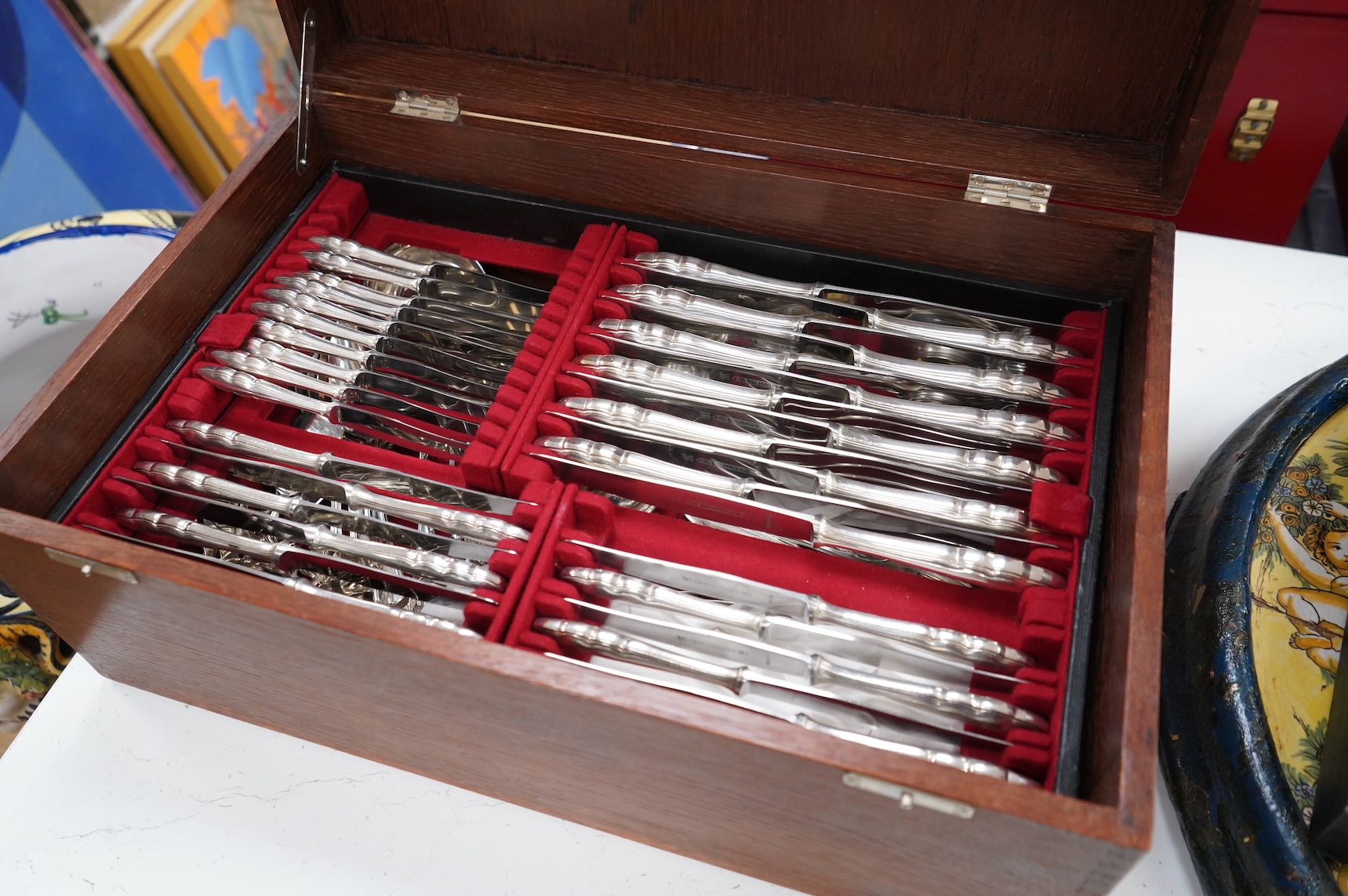 An oak cased, near complete, comprehensive canteen of plated cutlery together with odd cutlery from other sets.